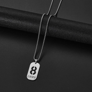 Macro detail of silver Lucky number 8 pendant with high quality box chain