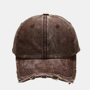 Detail of distressed brim and frayed edges on washed cotton vintage baseball cap