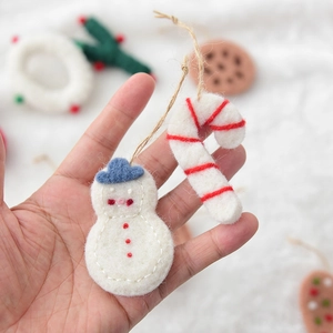 Handmade wool felt snowman and candy cane ornaments with natural jute string for Christmas
