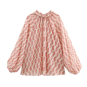 Women's beige blouse with red paisley print featuring ruffle collar and lantern sleeves