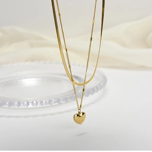 Double-layered gold snake chain necklace with heart pendant engraved with Love You