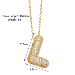 Detail showing letter L pendant size 2.3cm by 1.6cm with zircon pavé setting and gold finish