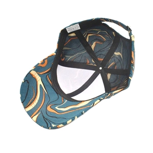 Colorful baseball cap featuring blue and orange fluid patterns with adjustable strap