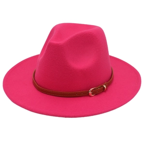 Detailed view of rose red wool felt fedora with a brown leather belt and golden buckle