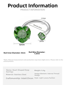 Macro detail of stainless steel horseshoe ring featuring green heart zircon with 6mm sizing
