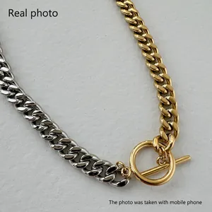 Two-tone 9mm wide stainless steel curb chain necklace with 18k gold plating and OT toggle clasp