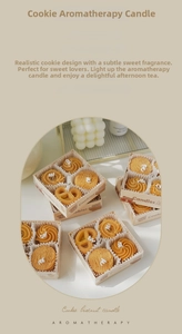 Detalle de velas aromáticas con forma de galleta en una caja de regalo de oso
