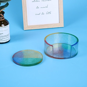Detailed macro view of sparkling resin coaster set and storage box with glitter finish