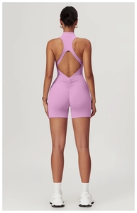 Rear view of pink high-stretch open-back yoga romper with scrunched butt detailing