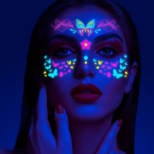 Neon butterfly and flower glow stickers on model face under UV light for music festivals