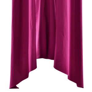 Detailed macro view of the pleated magenta fabric with elegant drape and asymmetric hemline