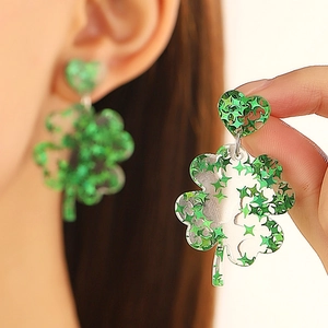 Saint Patrick's Day clover drop earrings with green glitter inside a heart stud and leaf