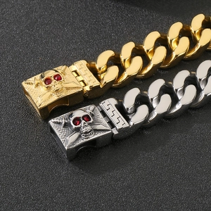 Close-up of red-eyed skull clasp on heavy duty stainless steel Cuban link bracelet