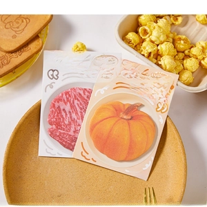 Detailed view of creative pumpkin and wagyu beef shaped sticky notes for scrapbooking