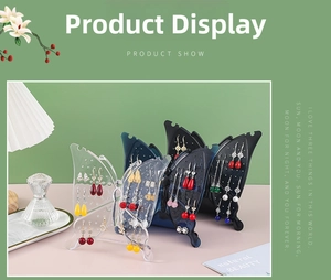 Macro shot of butterfly acrylic earring display stand with multiple hanging holes for jewelry