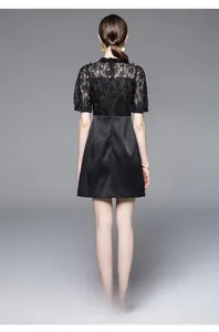 Detail view of the elegant lace stitching and back zipper on this black evening dress