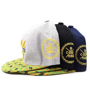 Detail of hip hop caps with lightning print brim and urban vintage side embroidery