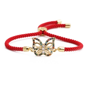 Red braided cord bracelet with gold butterfly charm featuring colorful zircons