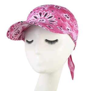 Detailed texture of rose red bandana print fabric on a lightweight summer sun hat