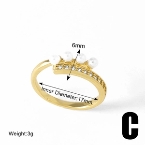 Detail view of gold floral pearl ring with crown design showing 17mm inner diameter