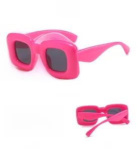 Detailed views of neon pink oversized square Y2K sunglasses with thick polished frames