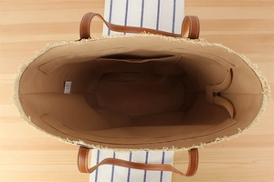 Interior view of large capacity paper straw tote bag with fabric lining and zip pocket