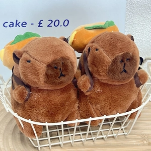 Plush Capybara plushies with hamburger backpacks in a white basket for gift giving