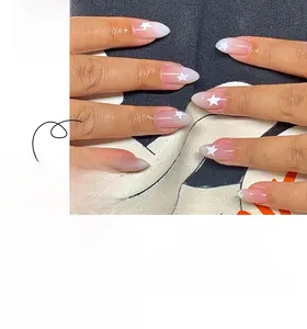 Detailed view of pink and white gradient press-on nails with white star patterns