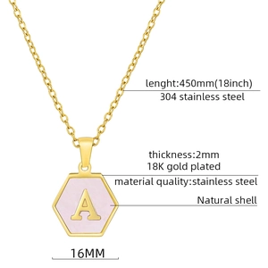 Detail of 18K gold plated hexagon necklace featuring a natural shell inlay with letter A