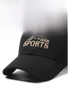 Detail of embroidered Outdoor Sports mountain logo on a black cotton baseball cap