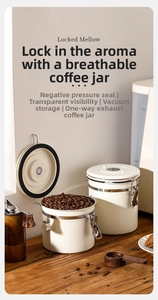 Detail of cream airtight coffee canisters with vacuum seal, vent valve and clear window