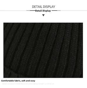 Detailed macro view of black ribbed knit fabric showing soft and warm texture