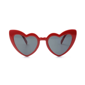 Front view of trendy oversized heart-shaped red sunglasses with dark polarized lenses