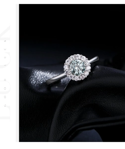 Macro shot of halo s925 silver ring with 0.5ct moissanite center stone on black leather