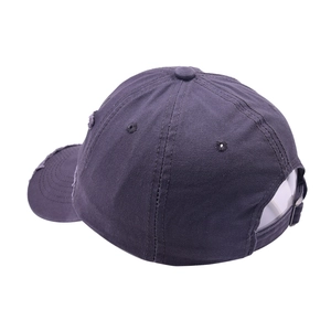 Close-up of distressed baseball cap details with metal buckle and worn fabric texture