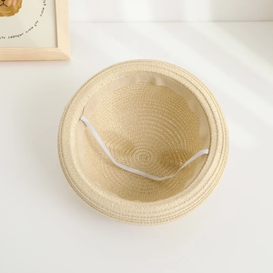 Light beige straw sun hat for toddlers with interior sweatband and elastic windproof strap