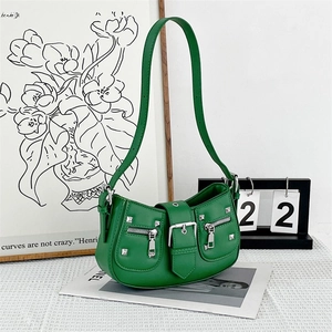 Chic green leather motorcycle moon bag with silver rivets and sleek buckle detail