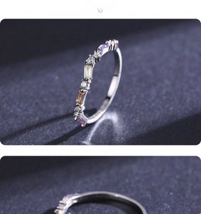 Detailed macro view of silver eternity ring with colorful rainbow cubic zirconia stones