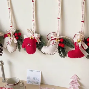 Handmade wool felt Christmas tree ornaments with mittens stockings and metal bells
