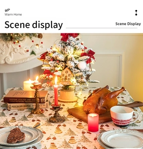 Detail of Christmas snowman tablecloth with festive patterns and warm holiday table setting