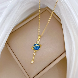 Starry planet necklace in gold finish with blue pendant and sparkling zircons on silk