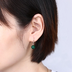 Elegant deep green agate bead drop earrings with S925 silver hooks on a model