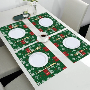 Set of 4 green Christmas table mats with red and white snowflake knit patterns for dining decoration