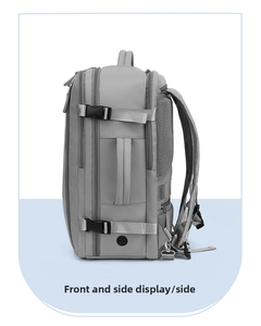 Side view of grey travel backpack showing buckle straps and breathable mesh padding