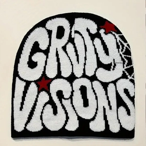 Detail of knitted jacquard GRIMY VISIONS lettering with red star on black beanie