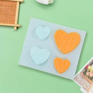 4-cavity heart silicone cake mold with textured ripples for baking and chocolate making