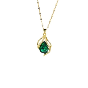Elegant gold-tone drop necklace featuring a green teardrop stone with crystal accents