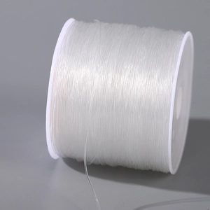 Strong elastic crystal string on white spool for DIY jewelry making and beading projects