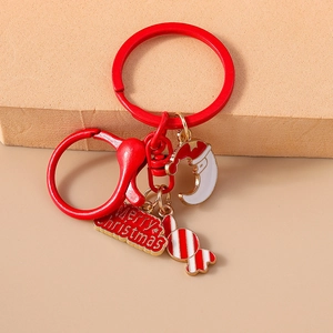 Detailed Christmas keychain with red moon face, candy cane charm and Merry Christmas plate