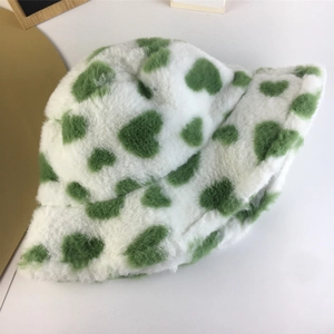 Winter faux fur bucket hat in white with green heart pattern for warm outdoor wear